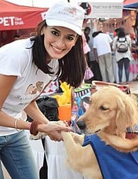 Photo of CIA baking & pastry alumna, Akanksha Arora and a furry friend