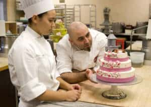 Duff Goldman ’98 works with CIA Baking and Pastry Student