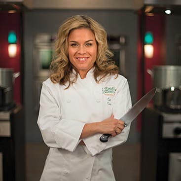 Cat Cora, CIA culinary arts alumni, is an Iron Chef, executive chef at Bon Appetit, and author.