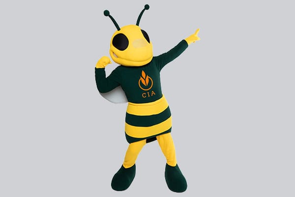 A smiling yellow and green bee mascot with antennae is posing confidently against a plain background. The bee is wearing a dark green outfit with yellow stripes on the body and has "CIA" written on its chest, one arm flexed and the other pointing outward.