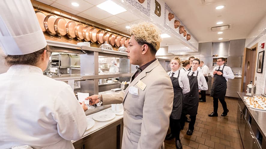 CIA students in the the kitchen for lunch service.